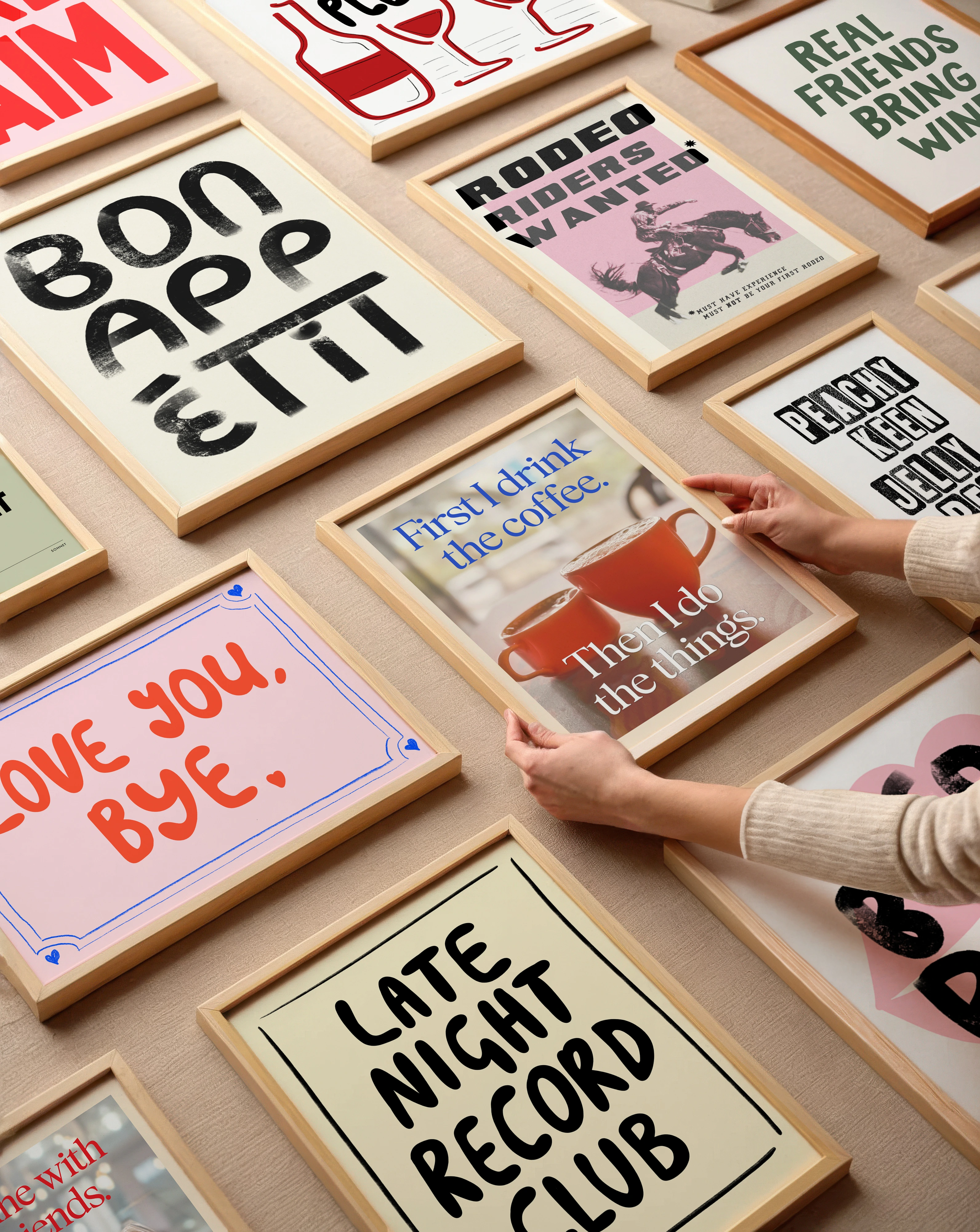Flat lay showing a selection of boobooskins prints in frames