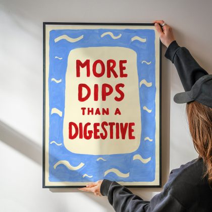 A funny sea dipping art print with the words "More Dips Than a Digestive" hand painted in red, surrounded by mid blue sea and waves.